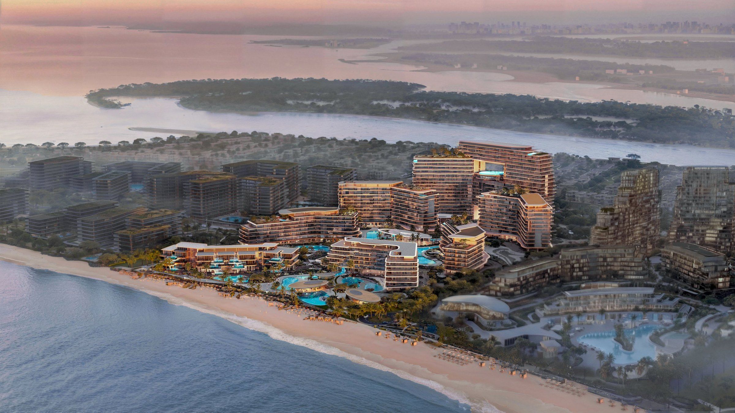 Aerial view of The Meriva Collection on Dubai Islands at sunset, with the beach in the foreground