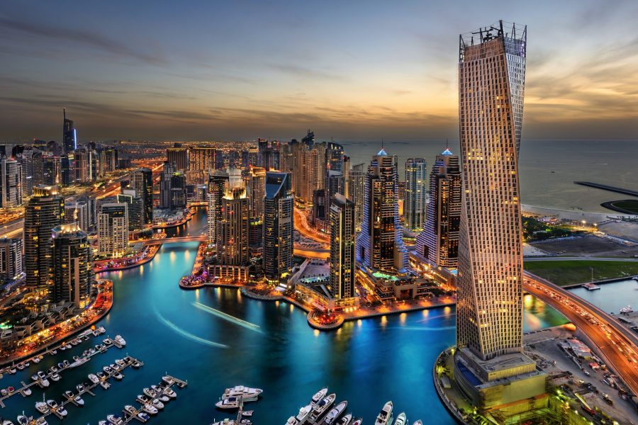 The tall buildings of Marina Bay in Dubai, the UAE during sunset